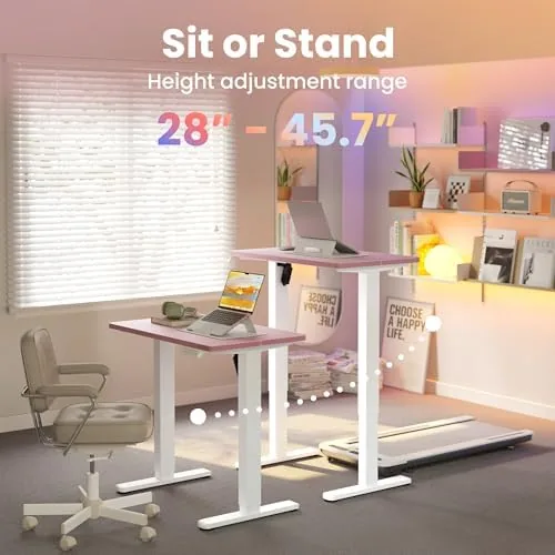 The compact HUANUO desk next to a full size standing desk showing the size difference