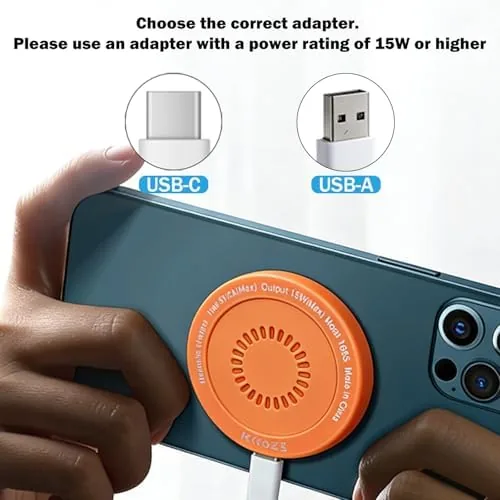 The orange pad next to a MagSafe puck for size comparison