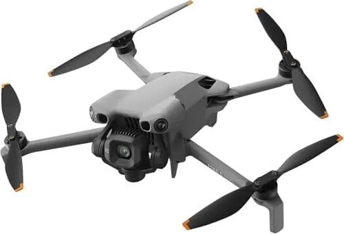 The three batteries, charging hub, and propellers laid out from the Fly More Combo