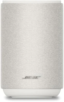 The Bose Lifestyle Ultra speaker in white smoke sitting in a modern living room