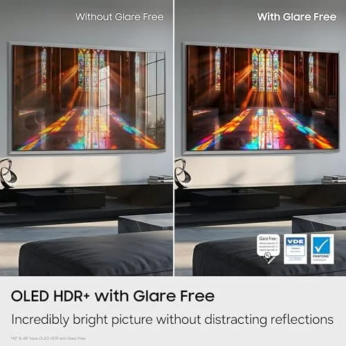 Family members gathered on the sofa watching a film on the 65-inch S90H