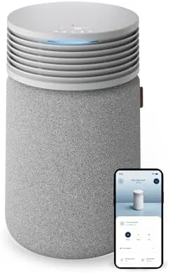 BLUEAIR Blue Signature SP3i air purifier on a side table in a living room