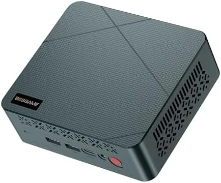 BOSGAME E2 mini PC sitting on a desk next to a keyboard showing its compact size