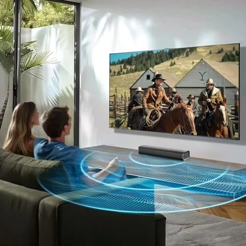 A laptop connected to the sound bar via Bluetooth showing a music app
