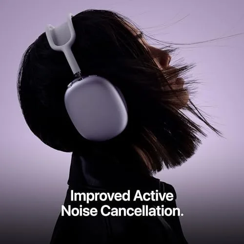 Person wearing AirPods Max 2 on a flight looking out a window