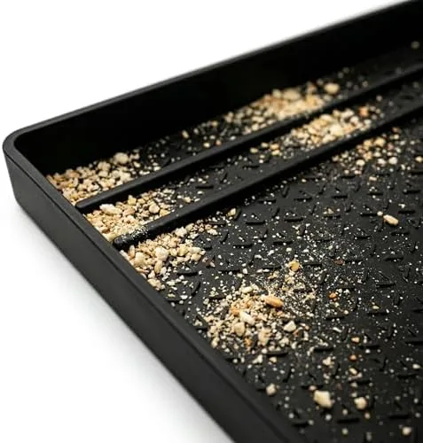 Crumbs collected on the silicone tray after a week of toasting