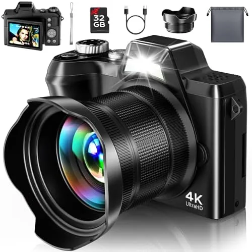 The 4K travel vlogging camera held up with its flip screen angled forward for a selfie