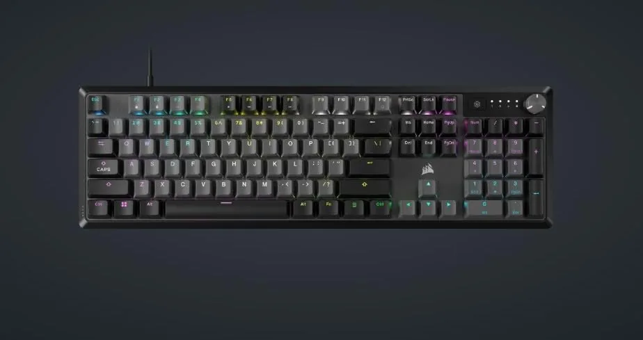 Corsair K70 CORE RGB keyboard on a gaming desk with RGB backlighting
