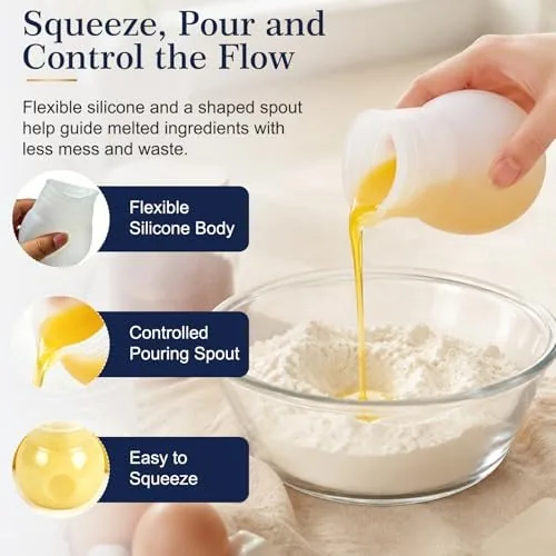 Melted butter pouring cleanly from the spout of the silicone pot into a glass measuring cup