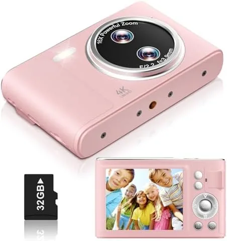 The pink 48MP point and shoot camera held in a hand outdoors
