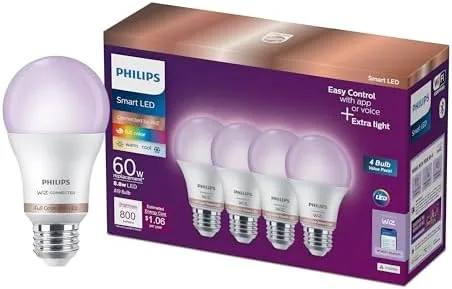 A PHILIPS smart color bulb glowing in a table lamp during setup