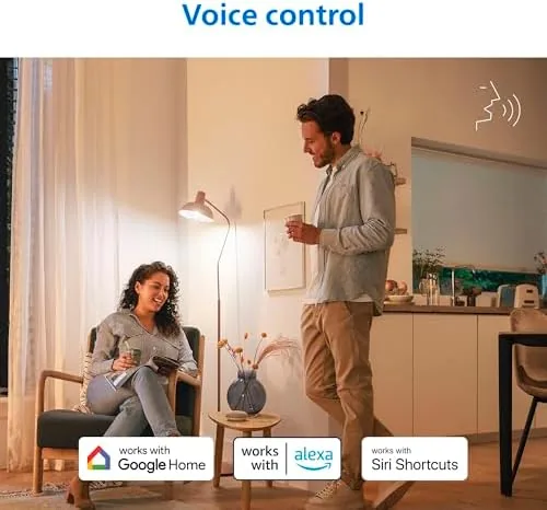 A bedroom lit with a soft warm scene at night from the smart bulbs