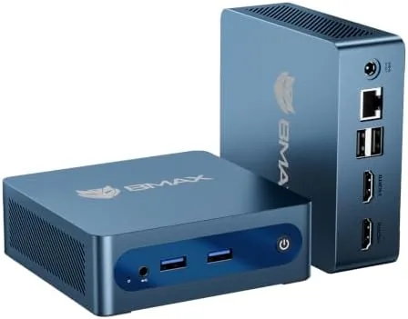 The Bmax B1 Plus mini PC sitting beside a monitor on a desk