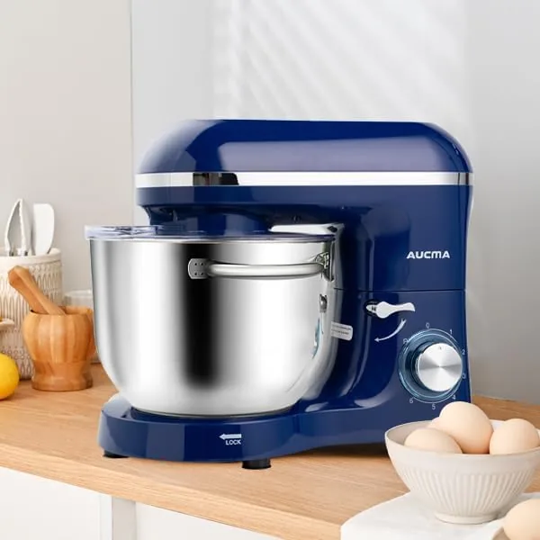 The royal blue mixer with a cake batter bowl and the pouring shield attached