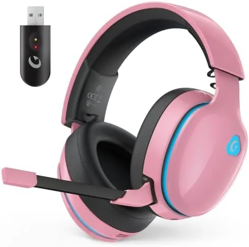 Blush pink wireless gaming headset resting on a desk