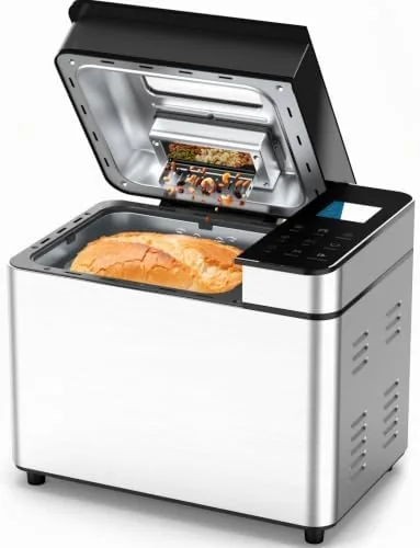 The 25-in-1 bread maker on a countertop with the visible lid showing a baking loaf