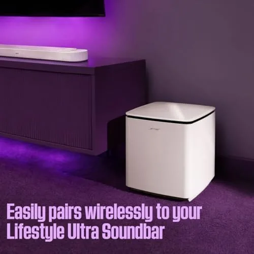The Bose soundbar mounted below a wall mounted television
