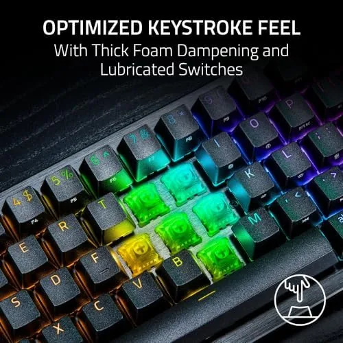 The Mini keyboard with its detachable braided cable beside a laptop for travel