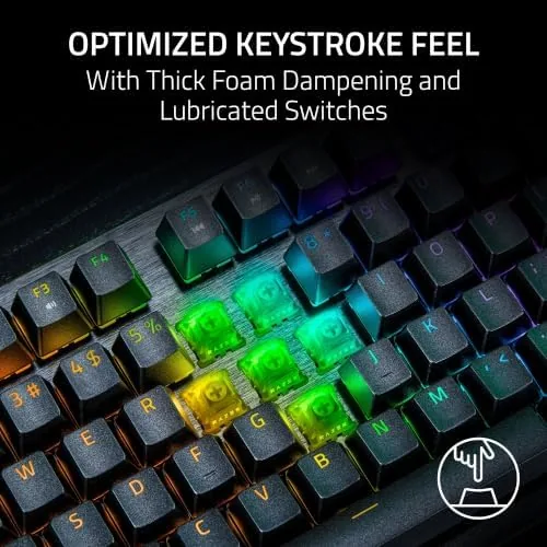 The TKL keyboard in a bright workspace with a laptop and documents beside it