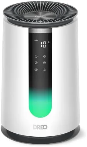 The DREO 338 air purifier in a bedroom with the air quality display glowing green