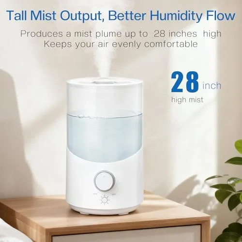The humidifier beside a crib in a softly lit nursery with the knob set to low